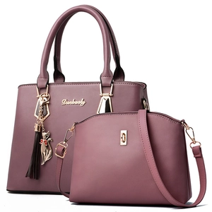 Purple faux leather tote bag and crossbody set with cat tassel and gold hardware