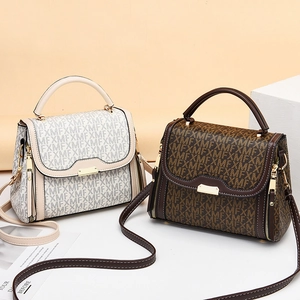 Chic Monogram handbag with double straps and gold lock in cream and brown colors