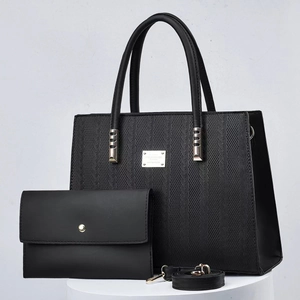 Two-piece black tote bag set with woven texture and matching envelope clutch purse