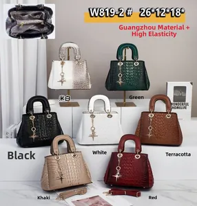 Detailed view of crocodile pattern tote bags in multiple colors with star pendant and size info