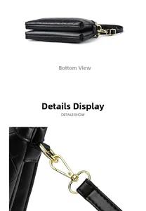 Close-up of black woven leather texture and pale gold metal buckle on shoulder bag