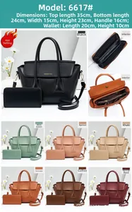 Detail view of large lychee texture faux leather tote bag with matching long zipper wallet
