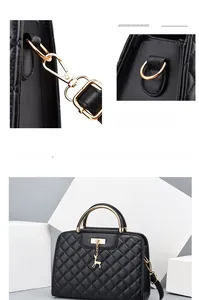 Detail of black quilted crossbody bag with golden hardware and deer charm