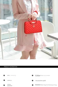 Detail of red quilted PU leather shoulder bag with gold handle and deer charm