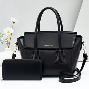 Black two-piece fashion handbag set with matching long wallet and gold lettering