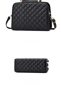 Rear and bottom view of black quilted leather handbag with gold hardware details