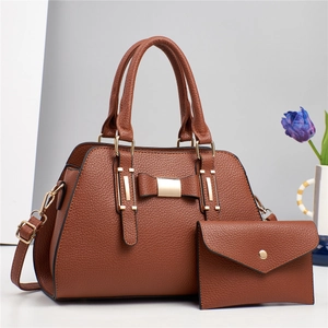 Brown litchi pattern tote bag with bow detail and matching small wallet set