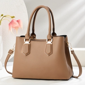 Classic brown tote bag in pebbled leather with gold hardware and removable shoulder strap