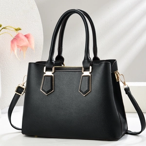 Chic black litchi pattern leather handbag with gold hardware and top handles