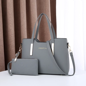 Ensemble chic de sac cabas et pochette gris avec détails dorés et bandoulière réglable