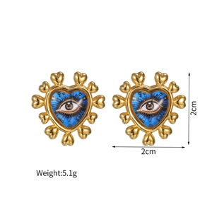 Detail view of heart-shaped evil eye stud earrings with size and weight measurements