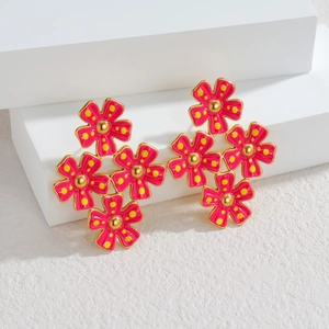 Boucles d'oreilles fleurs en or 18 carats avec émail rouge et pois jaunes sur socle