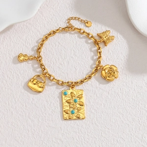 Bracelet à breloques en acier doré 18 carats avec pierres turquoise et fleurs