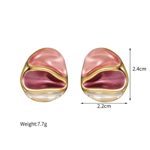 Detailed view of gold geometric earrings with pink enamel and 2.4cm by 2.2cm dimensions