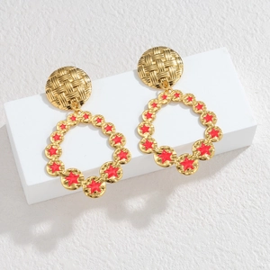 Elegant 18k gold plated star hoop earrings with red enamel on a minimalist display stand