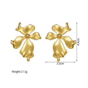 Detail view of 18k gold flower earrings with matte texture and size measurements