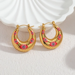 Boucles d'oreilles créoles dorées en acier avec motif œil grec et décor de coquillage