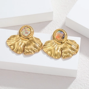 18k gold plated stainless steel ginkgo leaf earrings with shell inlay on white pedestals