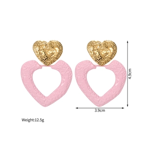 Detailed view of pink and gold heart earrings with size 4.9cm and weight 12.5g dimensions