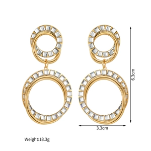 Macro view of 18k gold double hoop earrings with cubic zirconia and dimensions