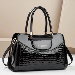 Black crocodile embossed patent leather handbag with gold hardware and fashion lettering
