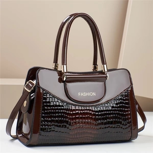 Dark brown crocodile embossed patent leather tote bag with gold hardware and top handles