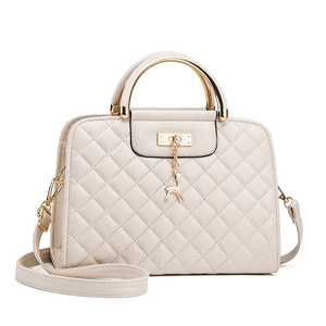 Chic cream-white quilted crossbody bag with golden metal handle and deer charm