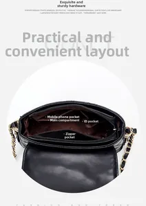 Detail view of the black quilted chain bag interior with multi-functional compartments