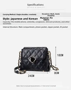 Detail of black quilted PU leather shoulder bag with gold chain and metal clasp