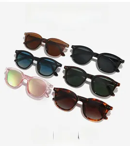 Detailed collection of vintage round sunglasses in various colors with metal stud accents