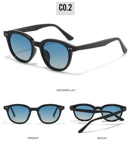 Detailed view of black polarized sunglasses with blue gradient lenses and metal rivets