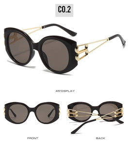 Detailed views of oval oversized sunglasses with black frames and gold hollow-out temples