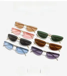 Collection of rimless cat-eye sunglasses with beaded edges and metallic temples in seven colors