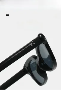 Detail view of glossy black cat-eye sunglasses with super elastic and lightweight frame
