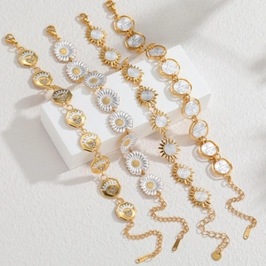 Gold plated stainless steel bracelets with white enamel daisy, sun, and heart charms