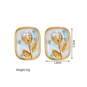 Detailed view of vintage gold 18k pearl flower earrings with size and weight marks