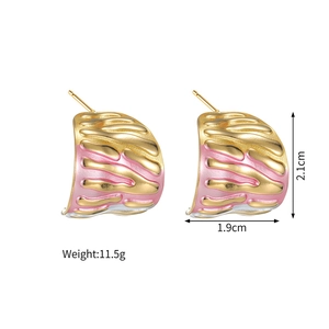 Detailed view of 18k gold plated irregular C-shape earrings with pink enamel inlay