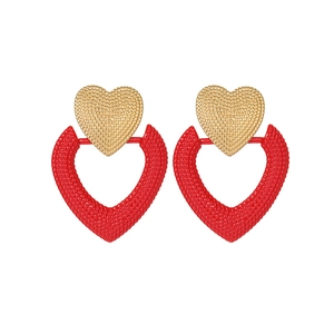Fashion 18k gold heart-shaped stud earrings with red hollow texture on white background
