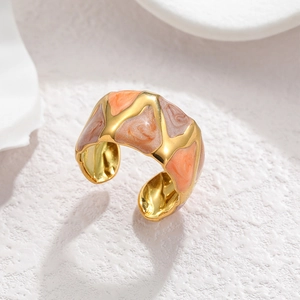 Detail of wide open ring with 18k gold plating and geometric marble texture enamel