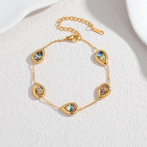Bracelet doré en acier inoxydable avec incrustations de nacre en forme de goutte