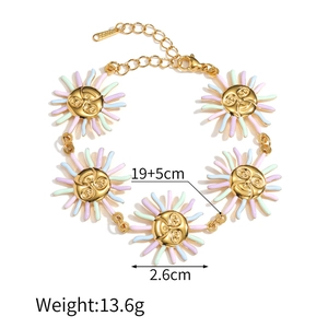 Detailed view of 18k gold plated sunflower bracelet with colorful enamel and S.STEEL tag