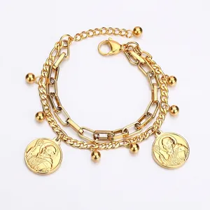 Double-layered gold bracelet with paperclip chain, round portrait coins and beads