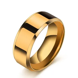 Macro shot of gold wide band ring with polished mirror surface and bevelled edges