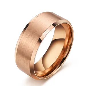 Detailed view of wide rose gold stainless steel ring with a smooth mirror-polished finish