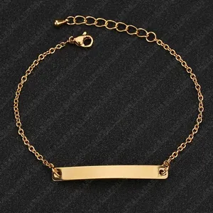 Macro view of polished 18k gold plated curved bar bracelet with DIY engraving area