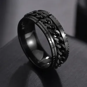 Detail shot of black stainless steel spinning ring with textured curb chain inlay