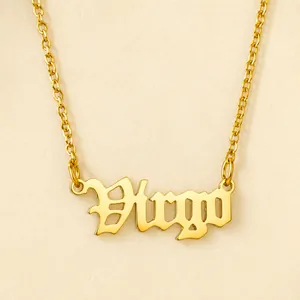 Macro detail of Virgo zodiac pendant in gothic font with golden stainless steel chain