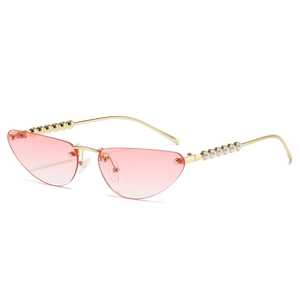 Pink gradient cat-eye rimless sunglasses with gold metal frame and pearl temples