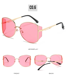 Detail of trendy round metal sunglasses with pink lenses and gold frame side shields