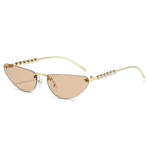Cat-eye sunglasses with gold metal frame featuring unique pearl and bead temple details